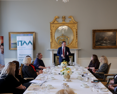 Government Minister talking to a room of people graduating