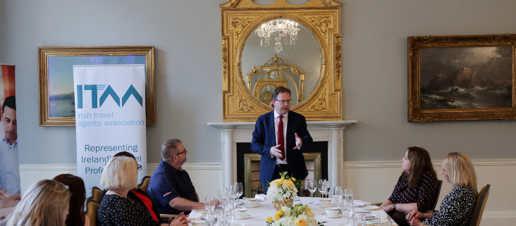 Government Minister talking to a room of people graduating